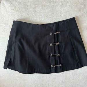 Brand new and never worn Unif mini skirt with safety pins